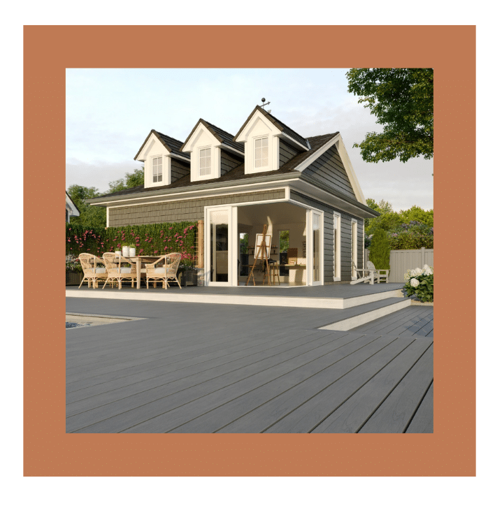 Stylish gray TREX composite decking extending from a cottage-style home with outdoor seating